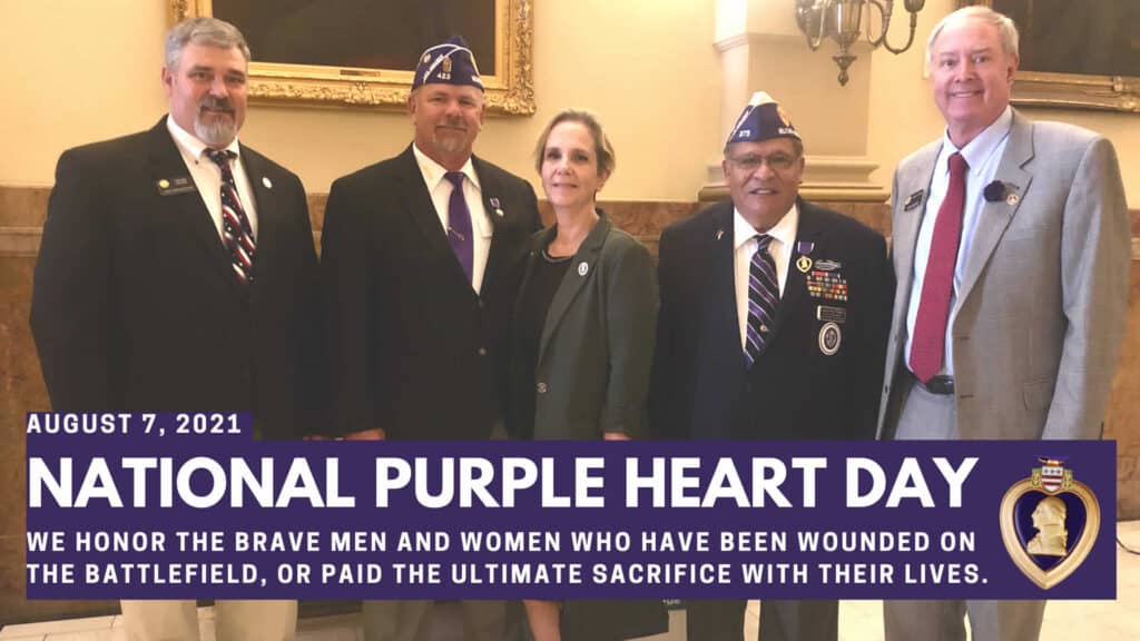 National Purple heart day photo of Rep. Richard Holtorf with some purple heart veterans.